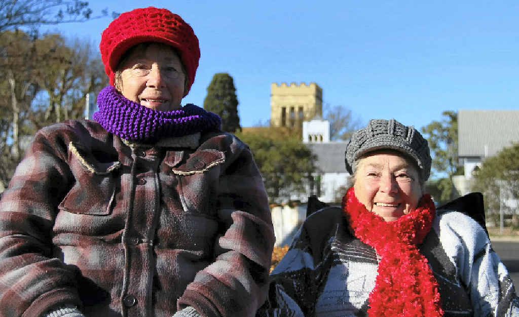 Marlene Pickard and Thelma Keogh set up chairs in the sun at yesterday’s markets to keep warm.